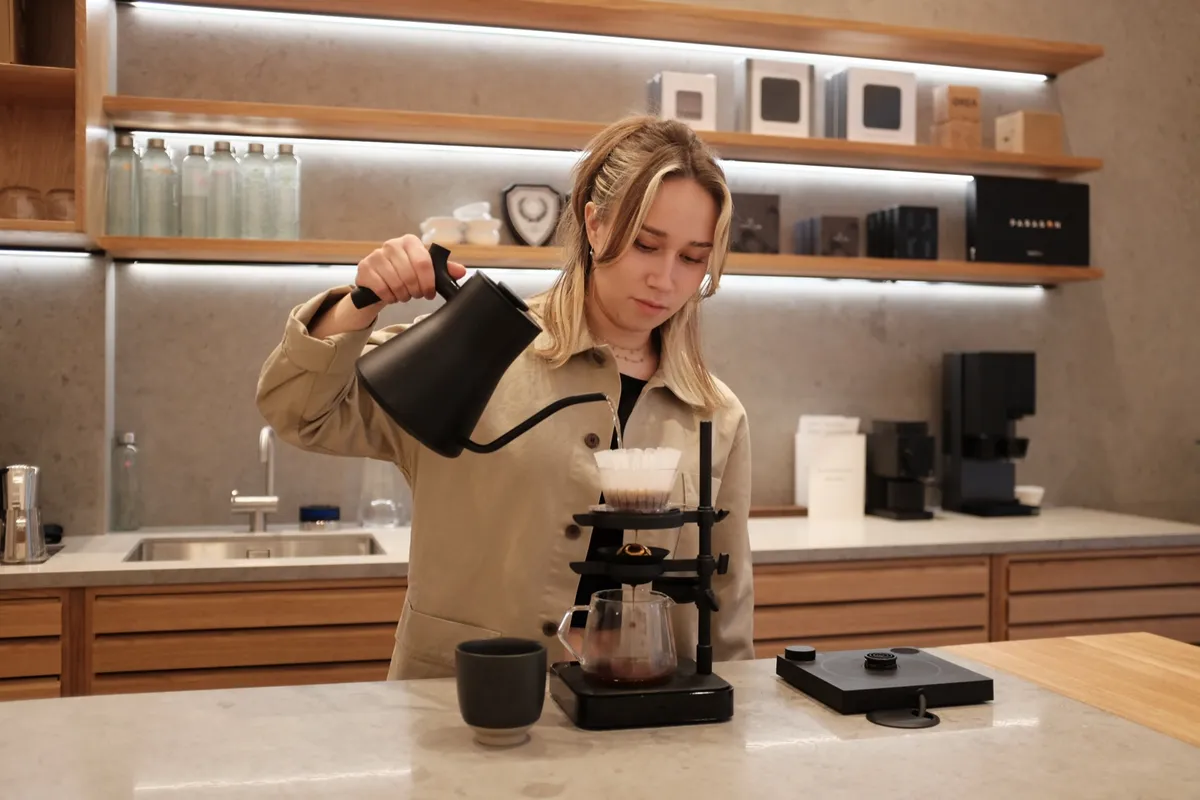 Julia Bergenstråle pouring filter coffee at Nordic Brew Lab, Stockholm
